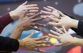 Student hands with class rings. 
